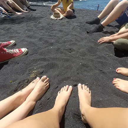 Enjoying our black sand beach classroom