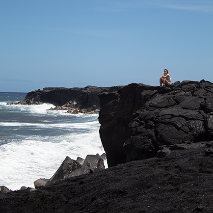 Taking time for reflection on an oceanside cliff